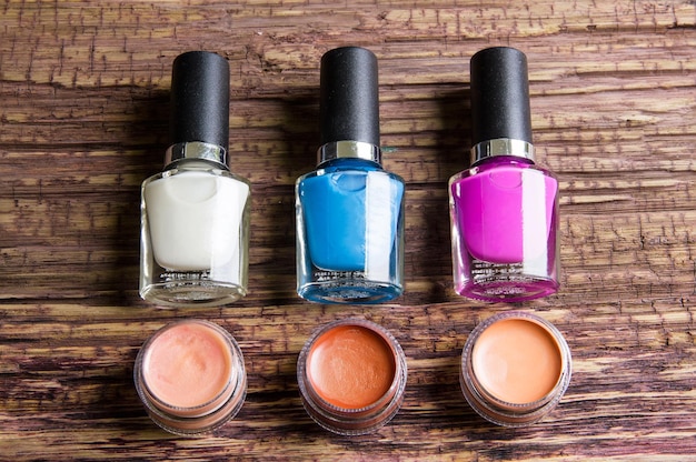 High angle view of colorful beauty products on wooden table