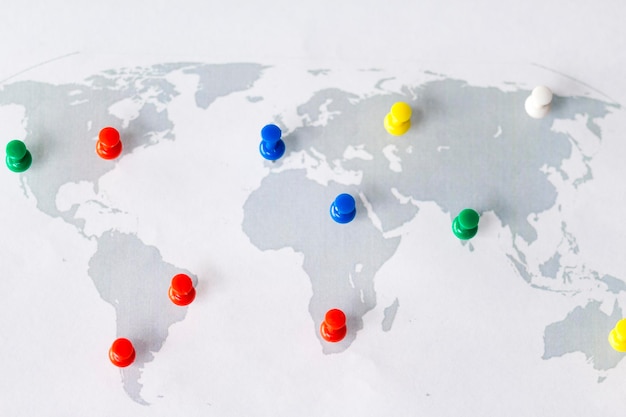 High angle view of colorful thumbtacks attached on map