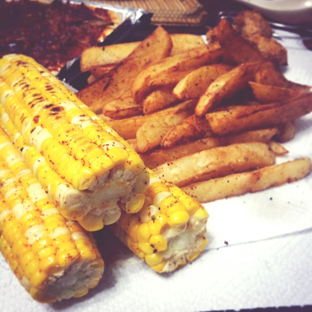 High angle view of corns and fried potatoes