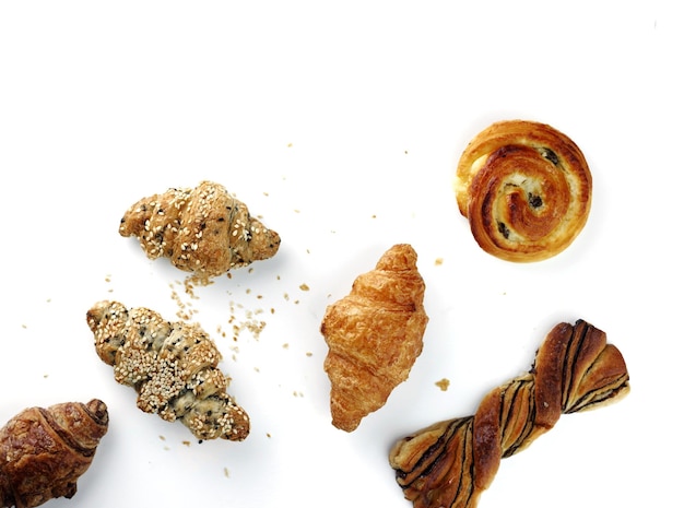 Photo high angle view of croissants and bread against white background