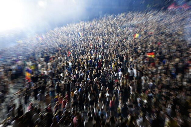 Photo high angle view of crowd enjoying during concert