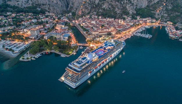 High angle view of cruise ship by cityscape