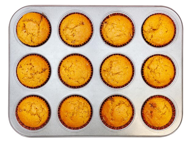 High angle view of cupcakes in baking sheet on table