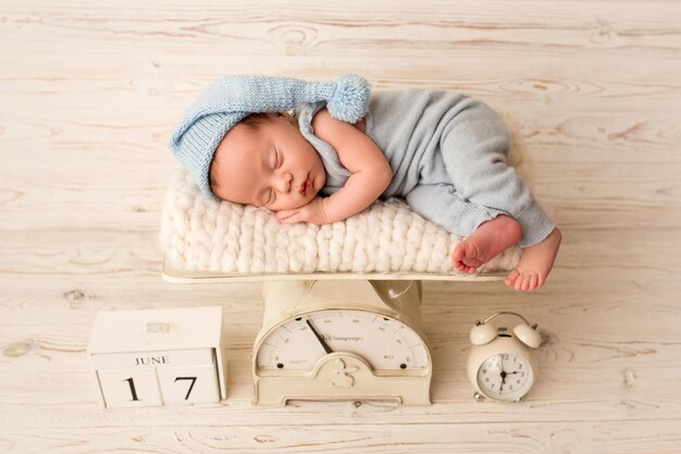 High angle view of cute baby girl sitting on table