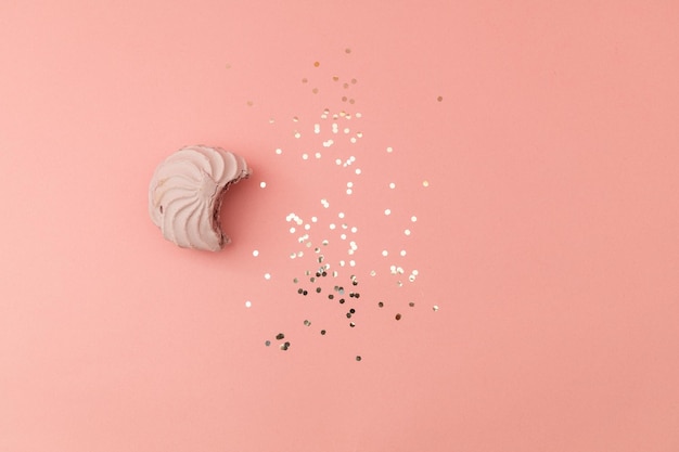 High angle view of dentures against pink background