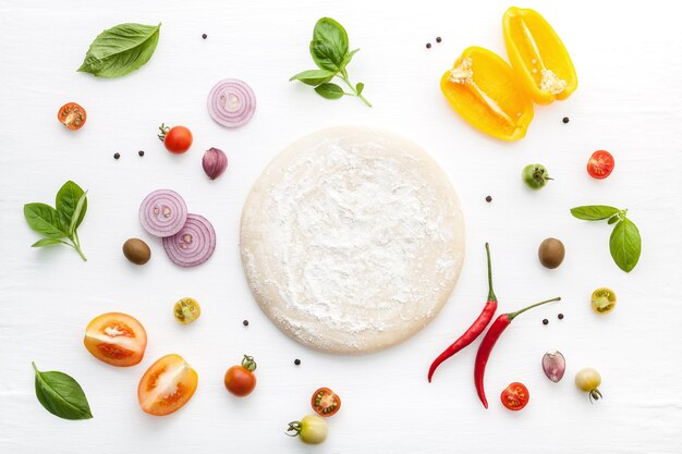 Photo high angle view of dough and ingredients on table