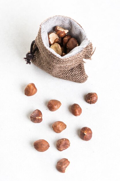 Photo high angle view of dried fruits on table against white background