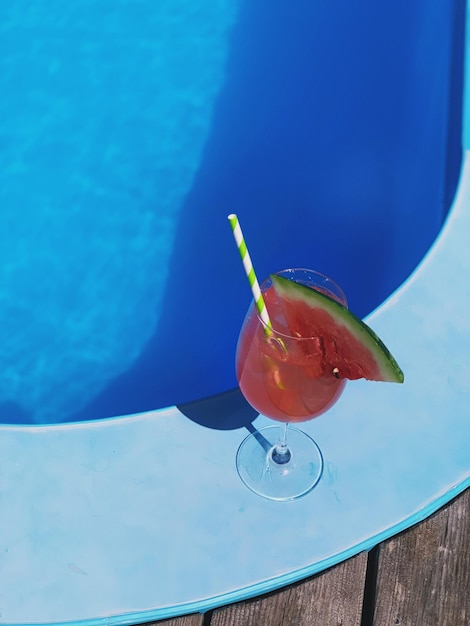 high angle view of drink in glass at poolside