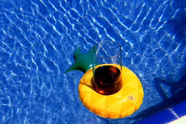 High angle view of drink in swimming pool