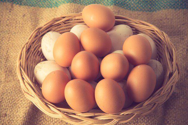 High angle view of eggs in basket on table