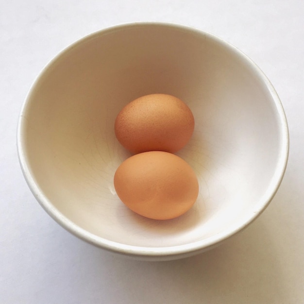 High angle view of eggs in bowl on table
