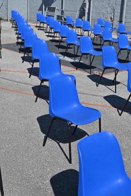 High angle view of empty chairs against blue wall