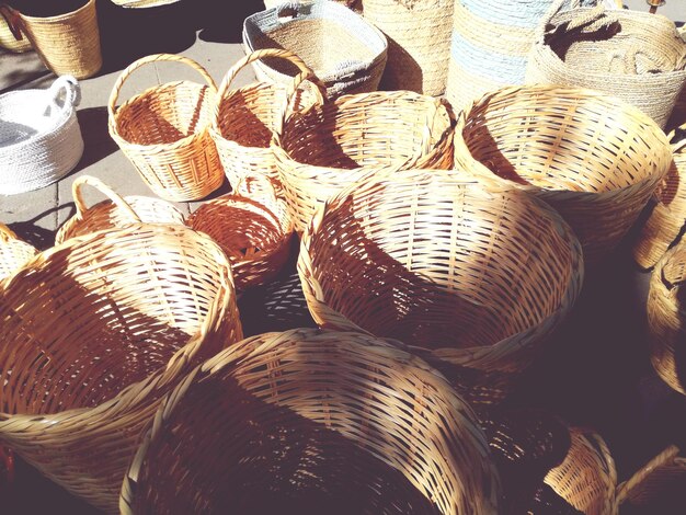 High angle view of empty wicker baskets at market stall