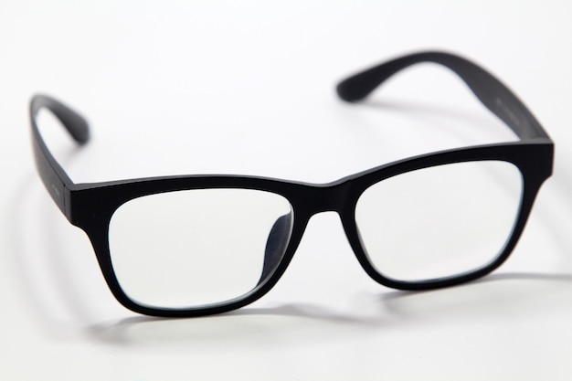 Photo high angle view of eyeglasses on gray background