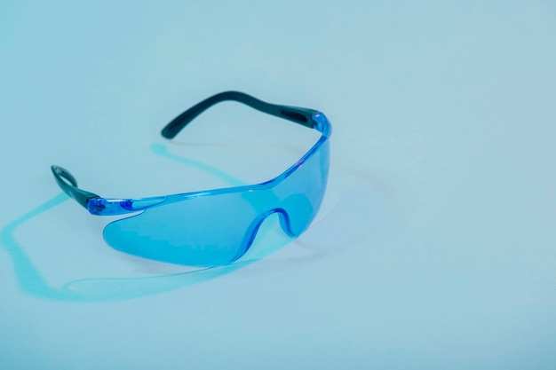 High angle view of eyeglasses on table against white background