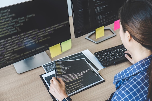 high angle view of female computer programmer coding in office