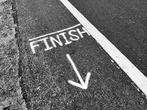 Photo high angle view of finish text on road