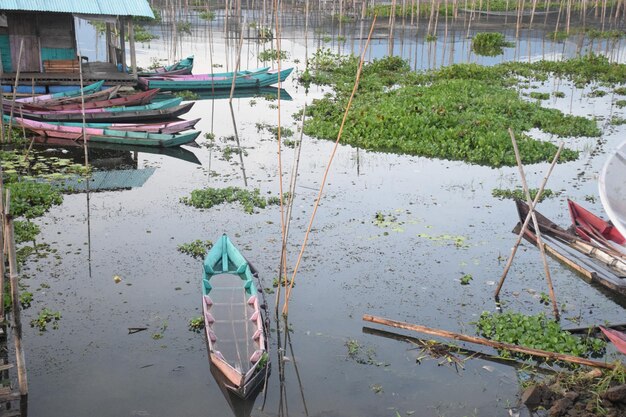 High angle view of fishing boats moored in lake during rainy season