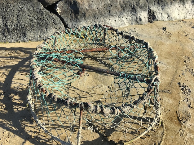 High angle view of fishing net on beach