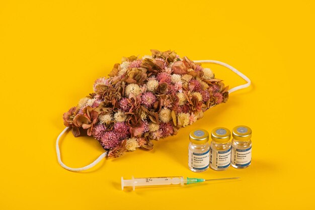 High angle view of flowers on table against yellow background