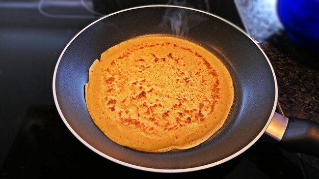 Photo high angle view of food in cooking pan