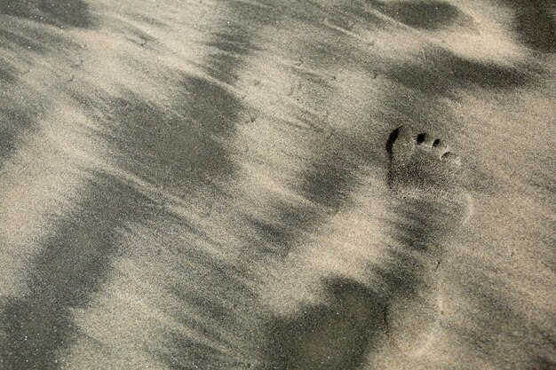 Photo high angle view of footprint on sand