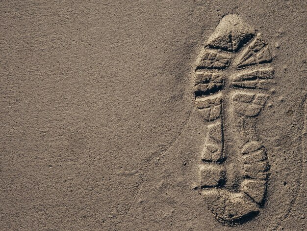 Photo high angle view of footprints on sand