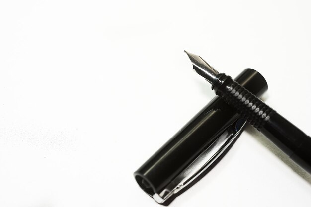 High angle view of fountain pen on white background