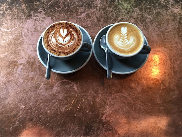 high angle view of fresh cappuccino served on table