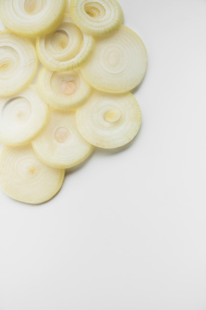 High angle view of fresh onion rings on white background