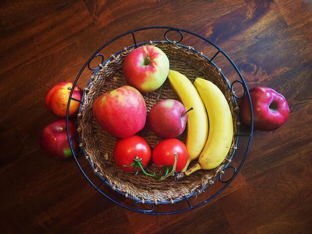 High angle view of fruits in basket on table