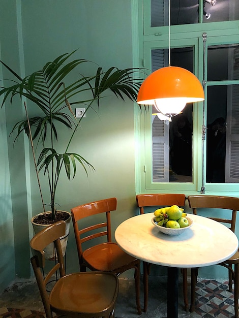 High angle view of fruits in bowl on table in restaurant