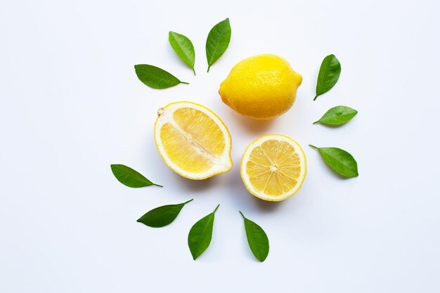 High angle view of fruits and leaves against white background