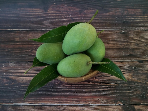 High angle view of fruits and leaves on table