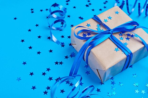 High angle view of gift box over blue background