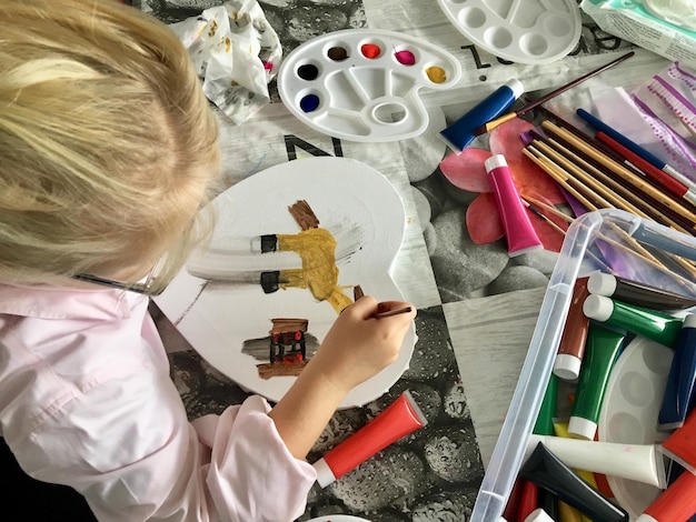 High angle view of girl holding table