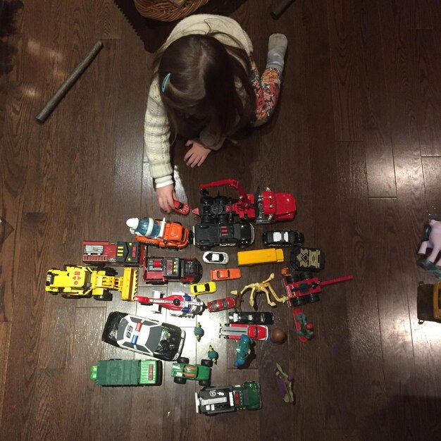 High angle view of girl playing with toys at home