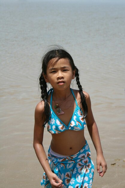 High angle view of girl standing at beach