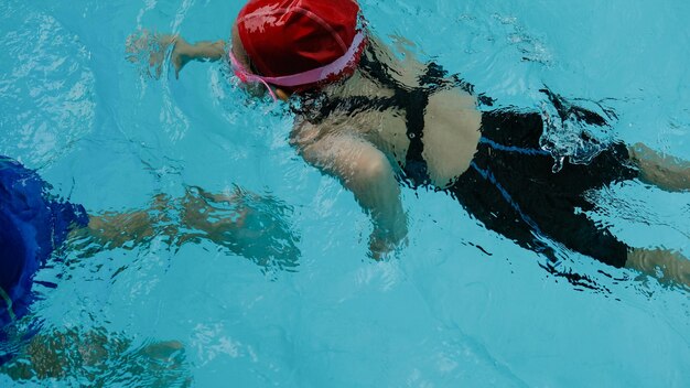 High angle view of girl swimming in pool