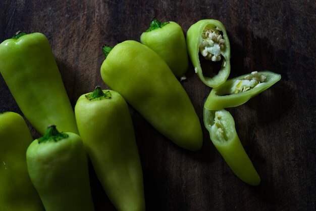 High angle view of green chili peppers on table