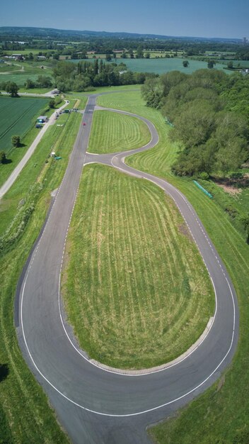 High angle view of green landscape against sky