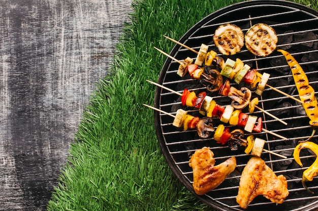 High angle view of grilled meat and vegetable on grill