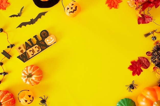 Photo high angle view of halloween decorations on yellow background