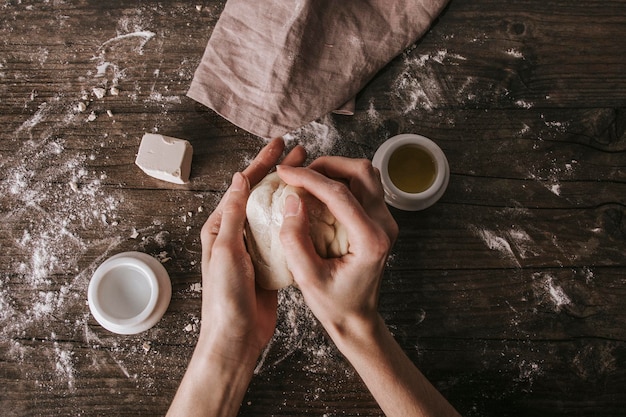 High angle view of hand holding coffee cup on table