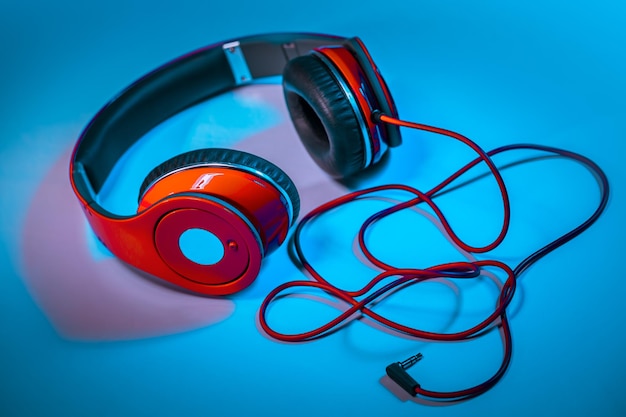 High angle view of headphones on blue background