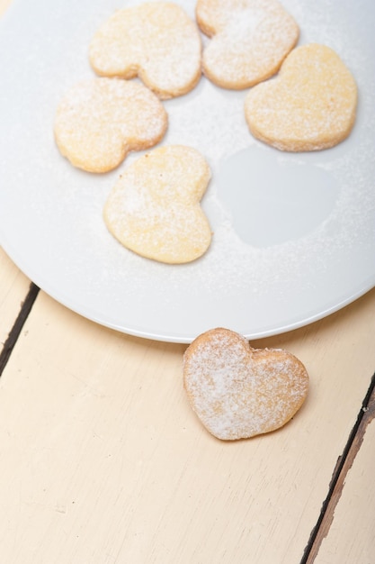 High angle view of heart shape cookies in plate on table