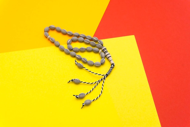 High angle view of heart shape on table against yellow wall