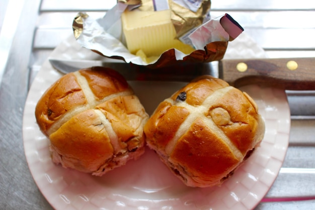 High angle view of hot cross buns in plate on table