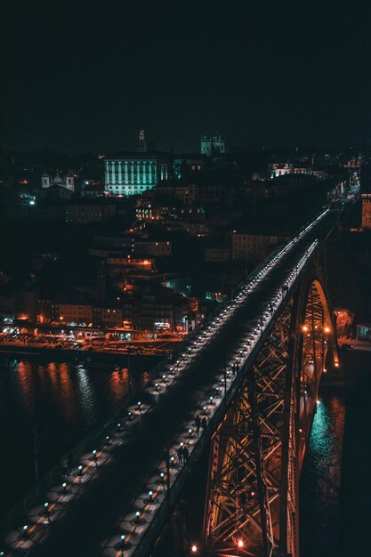Photo high angle view of illuminated bridge over river at night