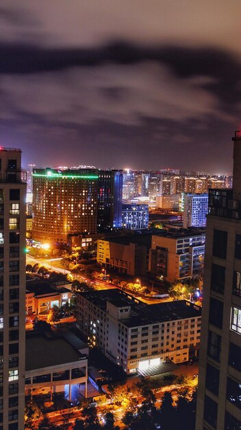 High angle view of illuminated buildings in city at night